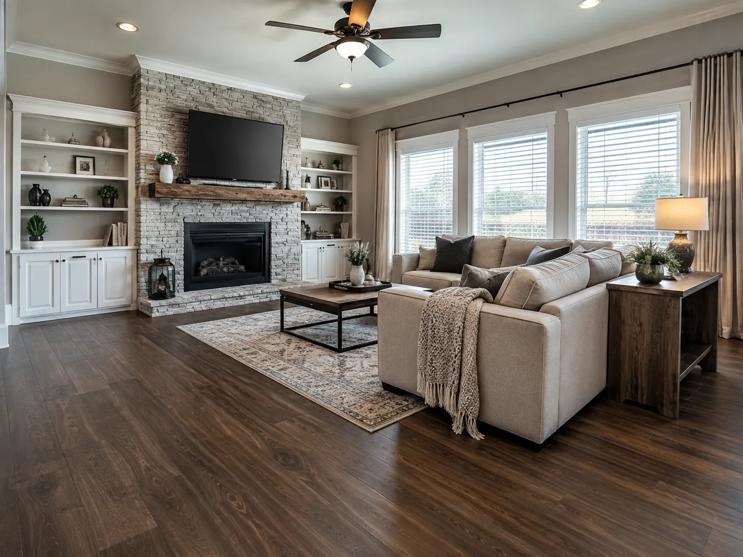 Renovated living room with fireplace built-ins and hardwood flooring